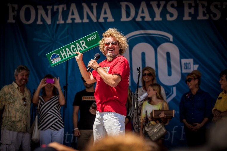Sammy shows off sign for the new "Hagar Way" that will be built in Fontana