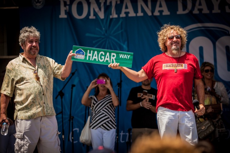 Sammy and brother Bob show off sign for the new "Hagar Way" that will be built in Fontana