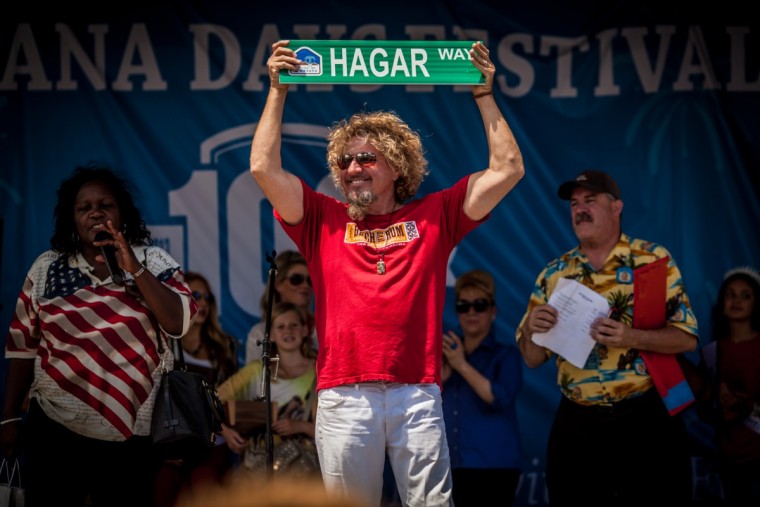 Sammy shows off sign for the new "Hagar Way" that will be built in Fontana